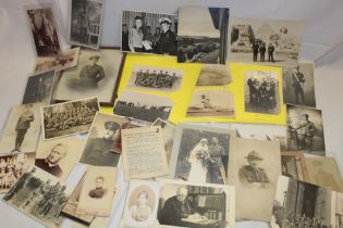 A selection of various military photographs, postcards, Naval postcards,