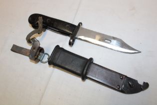A Russian AK47 bayonet in composition scabbard with suspension straps
