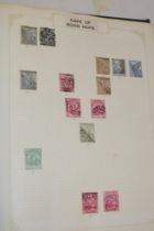 A folder album containing a selection of mint and used British Commonwealth and World stamps