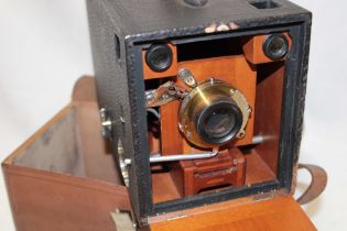 A Kodak Eastman "Bullseye" number 4 mahogany and brass mounted box camera circa.