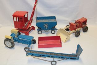 A Tri-ang tin-plate tractor with fore-end loader, Tri-ang crane, hopper trailer, elevator,