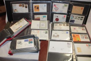 Eight folder albums containing a large selection of mixed GB and Foreign first day covers,