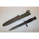 A United States M7 Vietnam era bayonet in composition scabbard marked "US M8A1 PWH"
