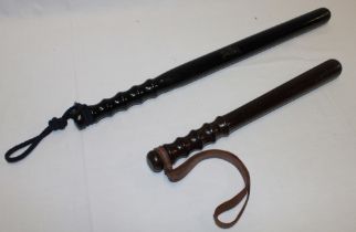 A turned wood Police truncheon and an ebonised long truncheon (2)