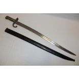 A 19th century French Chassepot bayonet with single-edged blade in steel scabbard with matching