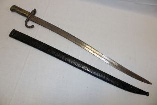 A 19th century French Chassepot bayonet with single-edged blade in steel scabbard with matching
