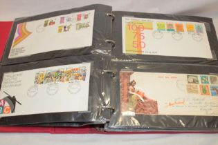A folder album containing a collection of 90 New Zealand first day covers,