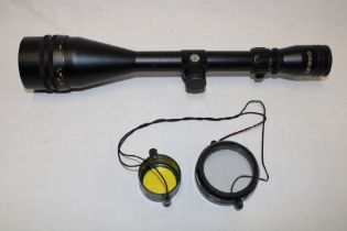 A Tasco Mag 50 18X50 telescopic sight