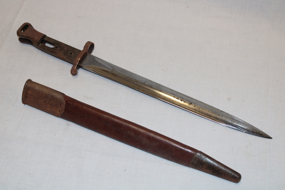 An 1888 pattern Lee Metford bayonet (minus grips) in steel mounted leather scabbard