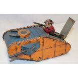An unusual clockwork tinplate First War tank by Louis Marx & Co New York with rising shooting