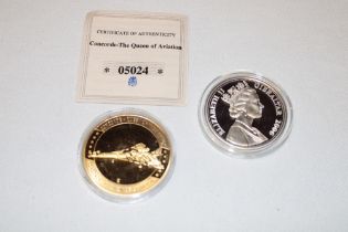 A 2006 silver First Commercial Flight of Concorde commemorative £5 coin and a gilt Concorde crown