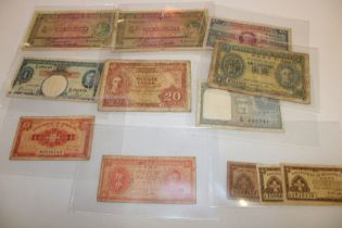 Twelve George VI Colonial bank notes including Hong Kong, India, Malta etc.