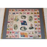 A framed display of silk cigarette cards including Regimental badges, flags, portraits etc.