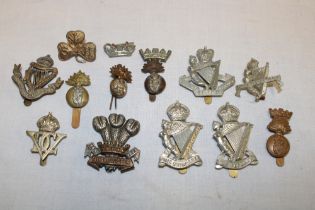 A selection of Irish military cap badges including the Leinster Regiment, Royal Ulster Rifles,