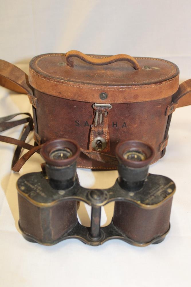 A pair of First War era military binoculars by Ross of London dated 1913 in leather case named to