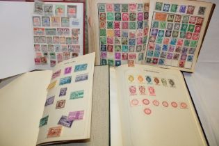 Three various albums containing a selection of mixed World stamps