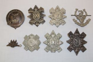 Seven various Scottish Highland cap badges and insignia including Seaforth Highlanders Territorial