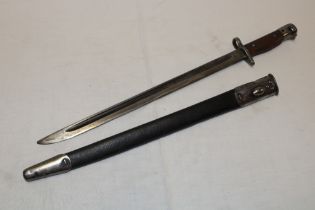 A 1907 pattern Lee Enfield bayonet by Wilkinson in steel mounted leather scabbard