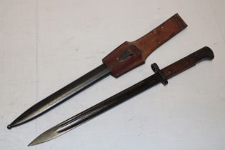 A Czech bayonet with blackened single-edged blade marked "CSZ1" in steel scabbard with leather frog