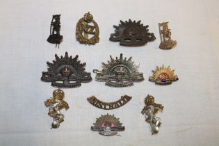 A selection of Colonial military cap badges including Australian Commonwealth Forces,