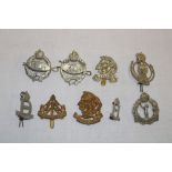 A selection of mainly Second War military cap badges and insignia including 22nd Dragoons,