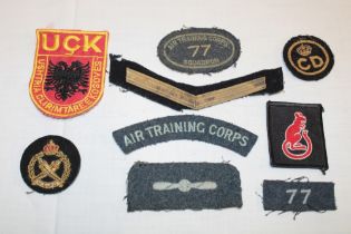 Various cloth military badges including Kosovo Forces, Air Training Corps 77 Squadron,
