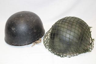 Two various British Armoured Corps steel combat helmets with liners