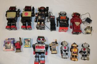 A selection of various robot toys and figures including numerous battery operated examples