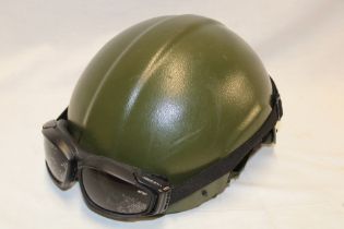 An Aircraft Armourer's Crew protective helmet with goggles