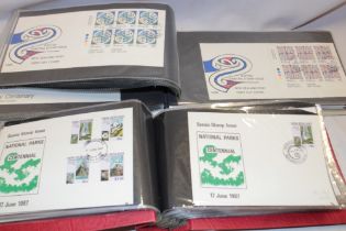 Two albums containing a collection of over 170 New Zealand first day covers 1984-1989