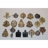 A selection of various military cap badges including two Army Chaplain's Department badges, ATS,