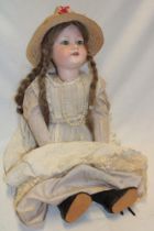 A German porcelain headed child's doll by Armand Marseille of Germany "309n A11M" with composition