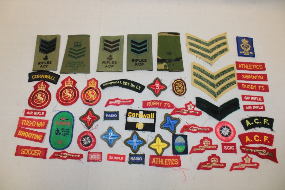 A selection of various cloth Cadet Forces insignia including "Cornwall Cdt. Bn. L.I.