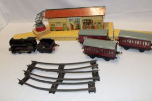Hornby 0 gauge - clockwork tin-plate locomotive and tender, three carriages,