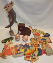 A painted wood rocking parrot figure, two china doll's heads marked "50W10",