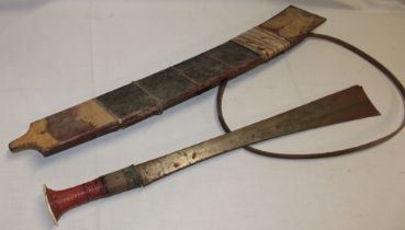 An Eastern-style sword with 22" broad single-edged blade and lacquered and brass hilt in bamboo