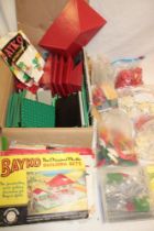 A selection of various Bayko building kits together with instruction manuals,