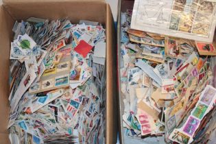 Two boxes of various World stamps on paper