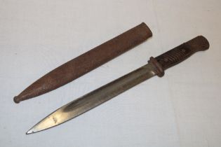 A Second War German Mauser bayonet with single edged blade in steel scabbard