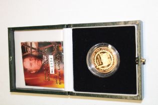 A 2004 gold proof £2 coin commemorating the 200th Anniversary of the Steam Locomotive,