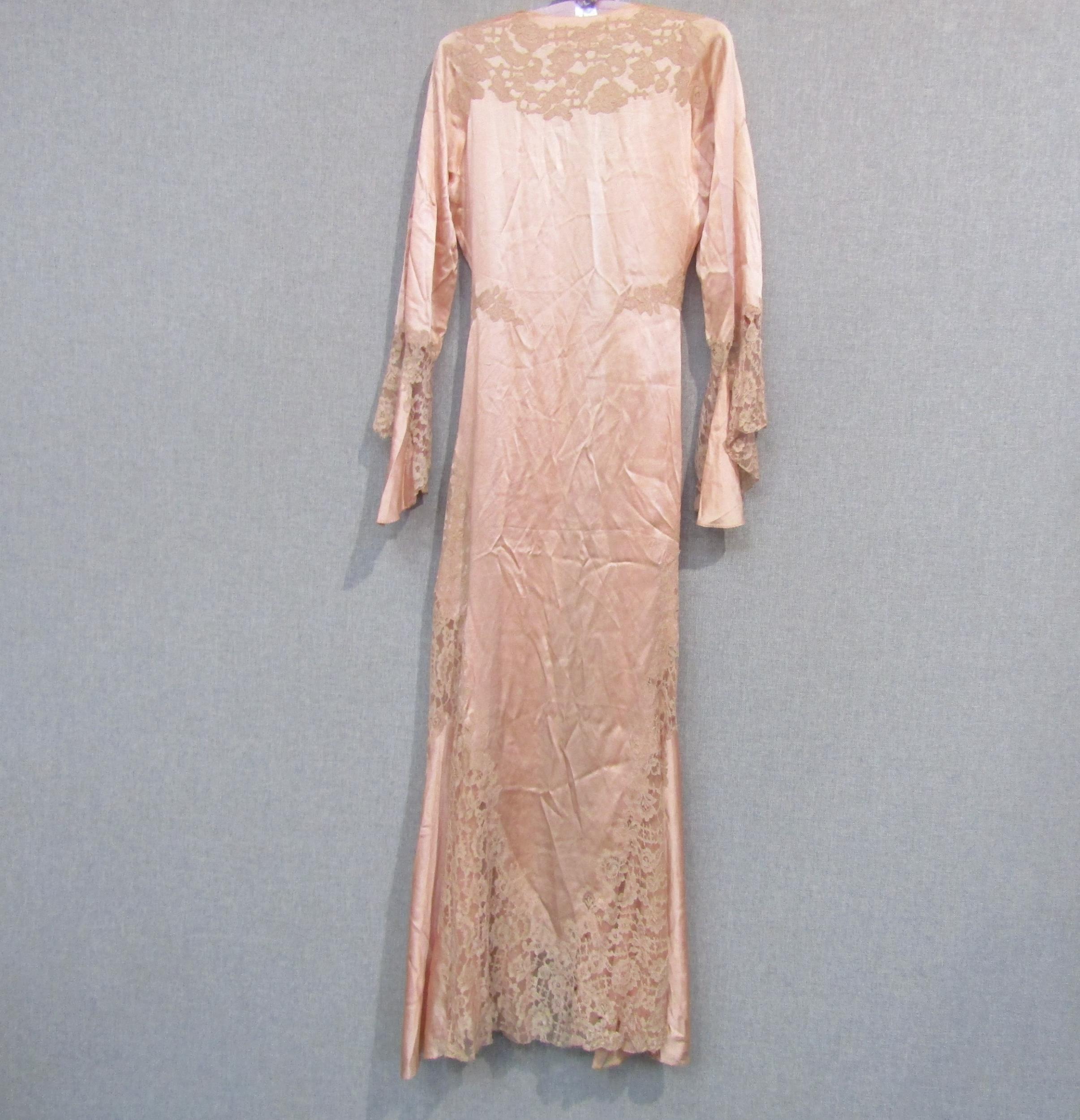 A 1930's/40's peach silk dressing gown with toning lace detail, a/f in some areas to the lace, and a - Image 3 of 3