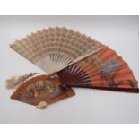 Three late 19th/early 20th Century fans, two with carved guards/sticks, one painted fabric of Iris