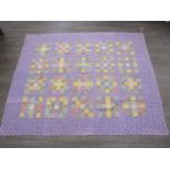 A vintage 1930's Suffolk puff hand-stitched throw, lilac, yellow colourway, 172cm x 138cm