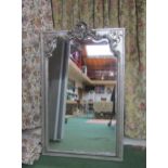 A shabby chic style silver painted wall mirror, foliate design