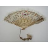 A late 19th/early 20th Century fan with painted bone guard sticks and painted feathers of foliate