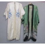 Two Early to mid 20th Century kimono style dressing gowns, cream silk hand embroidered in blue