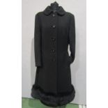 An early 1970's "Top Collection" by Kashmoor, black wool tailored coat, single breasted with a black
