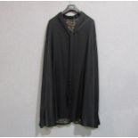 An Edwardian black silk evening cloak