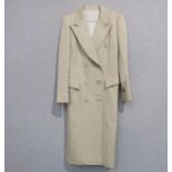 A 1970's classic tailored beige double breasted lady's coat, made in Paris for Coronel, slight