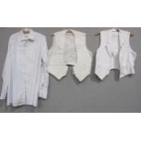 Three gents period white evening shirts and two evening white waistcoats